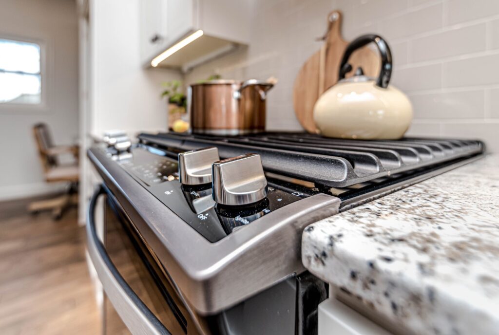 Stainless steel gas cooktop installed in a finished kitchen benchtop